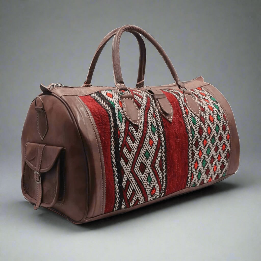 A handcrafted Moroccan travel bag featuring premium leather and vibrant kilim accents with intricate red, white, green, and orange patterns